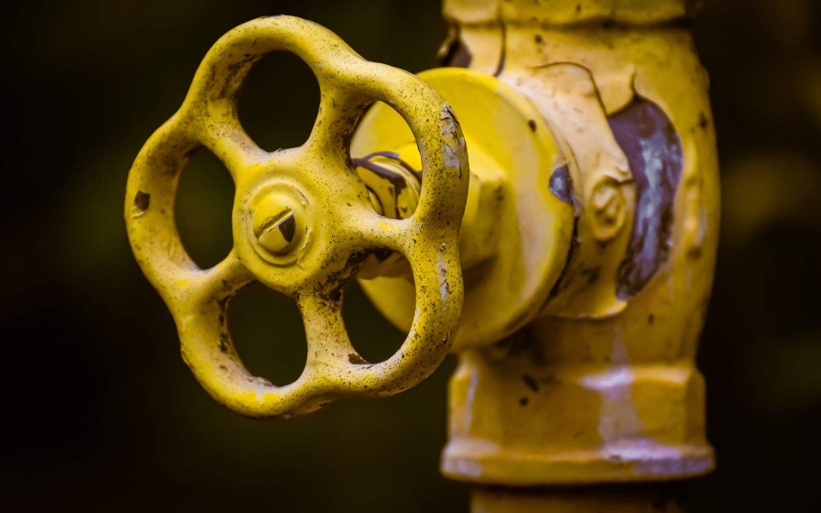 Hand turning a main water shut-off valve
