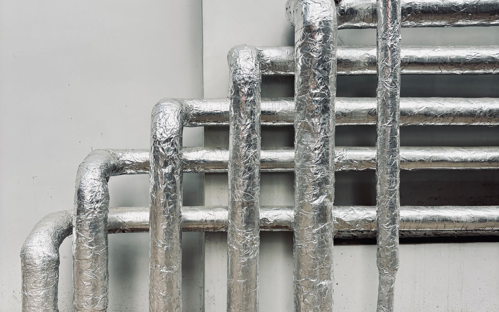 Insulated pipe along an exterior wall